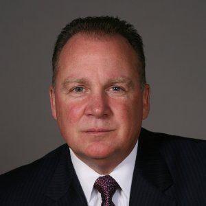 ROBERT J. TRACY