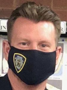 COREY L. BEHAN